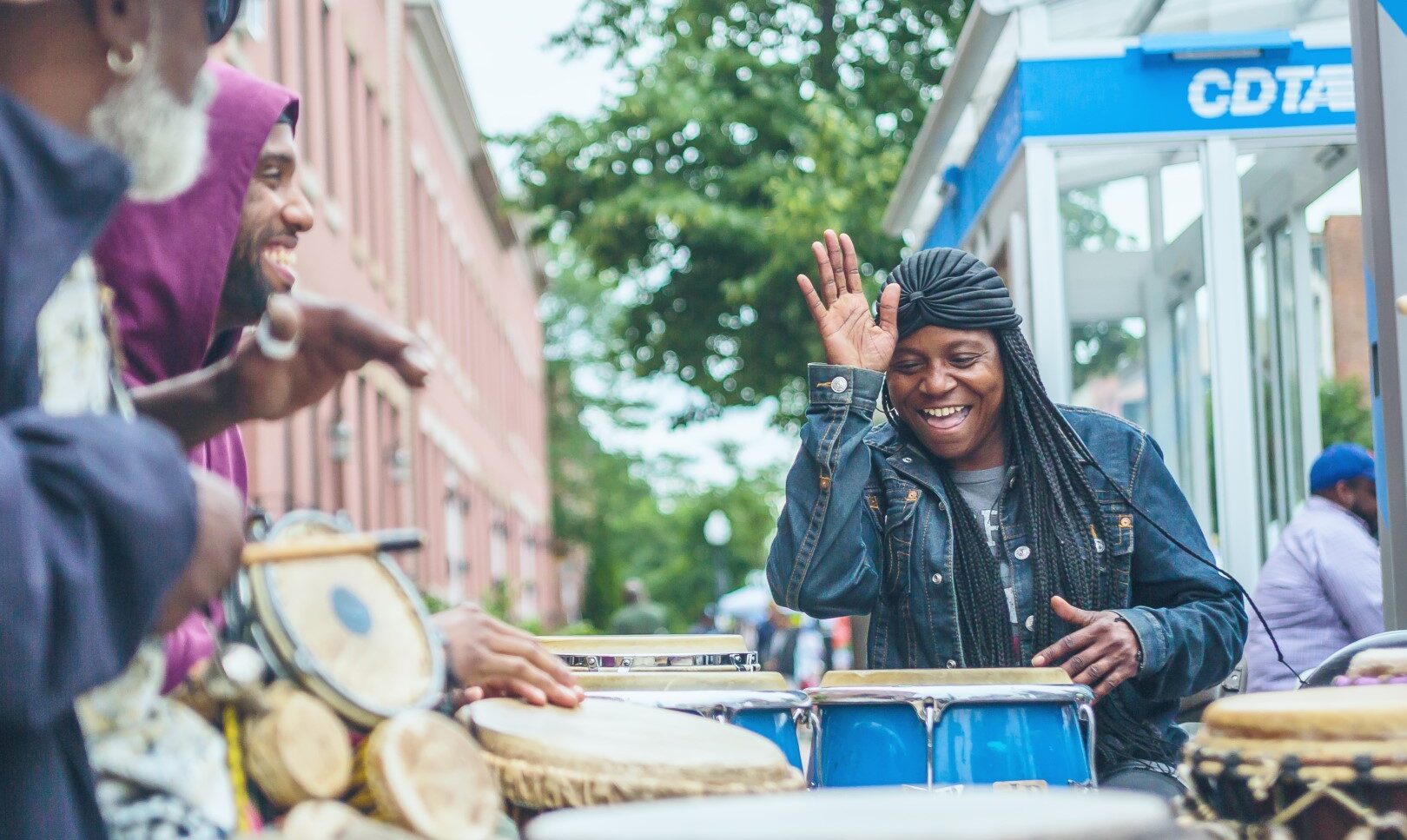 BIPOC people playing in drum circle
