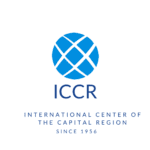 A blue and white logo of the international center of the capital region.